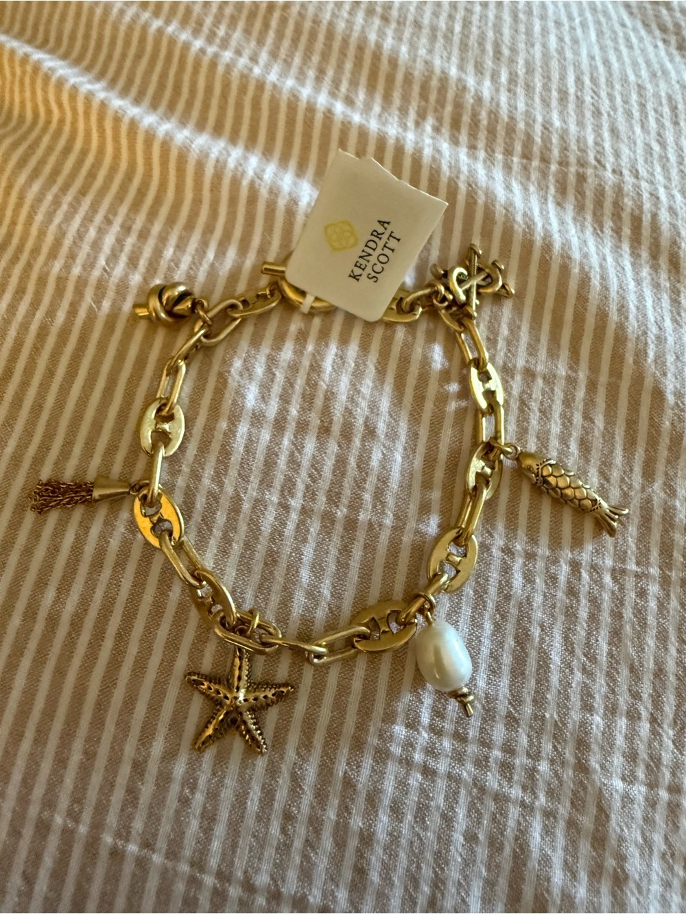 Kendra Scott Gold Charm Bracelet with Pearl Drop and Nautical Charms